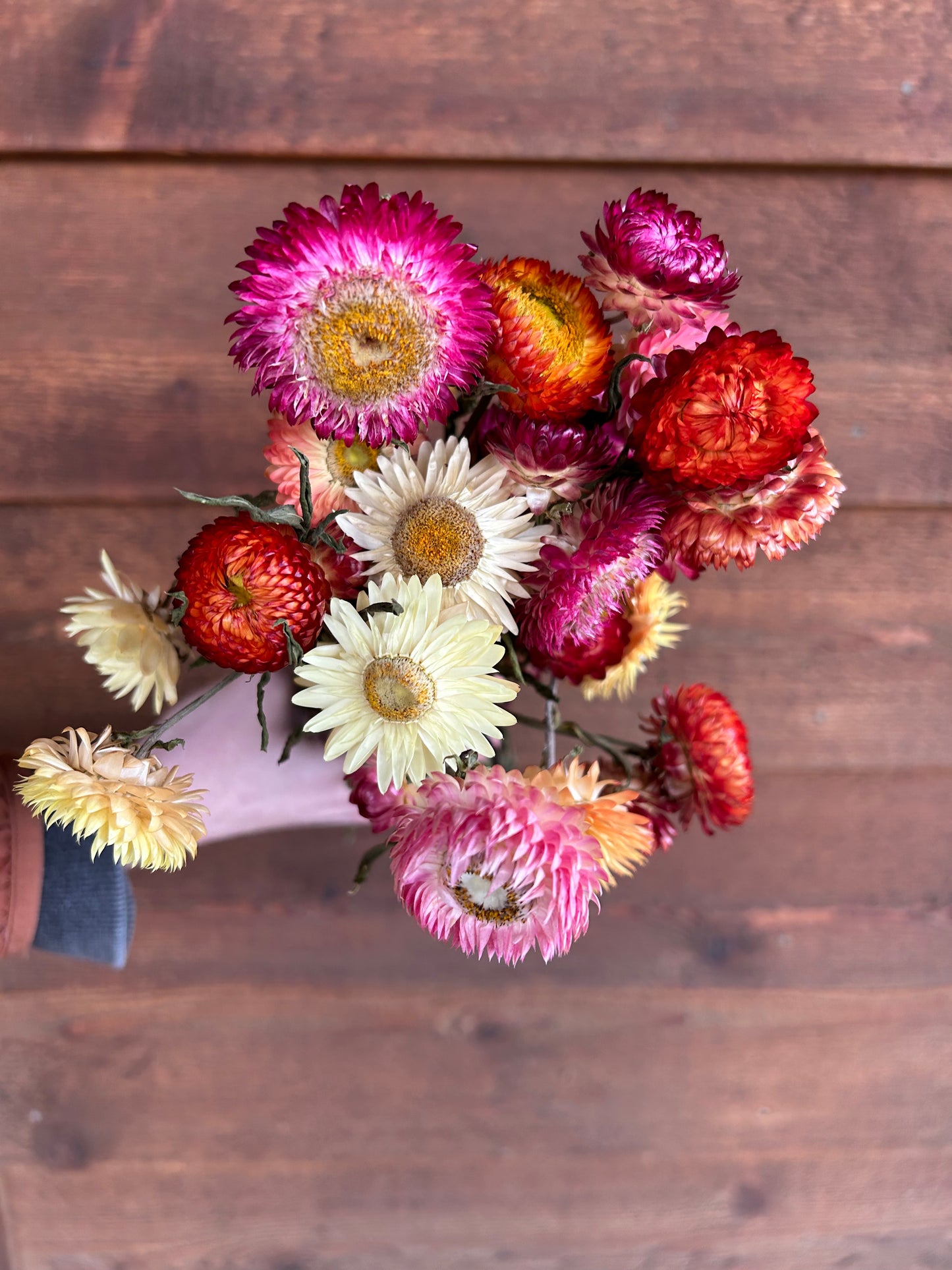 Bouquet of dried flowers on a wooden surface